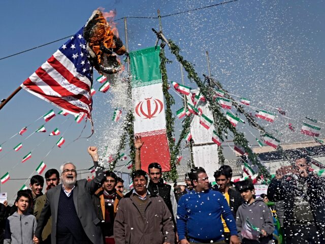 Demonstrators burn a U.S. flag during their annual rally commemorating Iran's 1979 Islamic