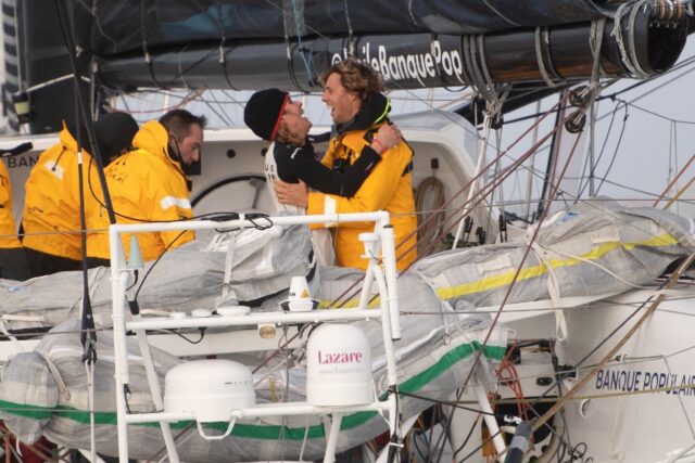 Clarisse Cremer (left) celebrates with her husband at the finish of the last Vendee Globe