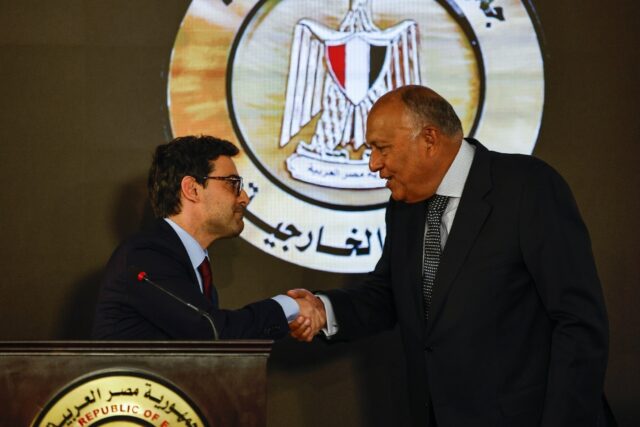 Egypt's Foreign Minister Sameh Shoukry and his French counterpart Stephane Sejourne hold a