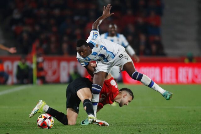 Firing blanks: Real Sociedad forward Umar Sadiq (R) battling with Mallorca defender Jose