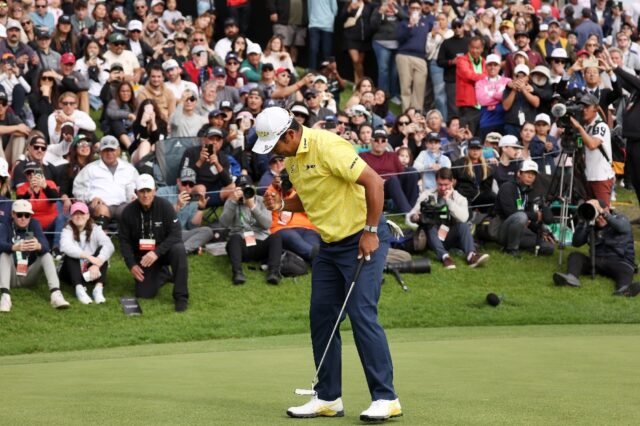 Hideki Matsuyama of Japan reacts to his winning putt on the 18th green in the final round