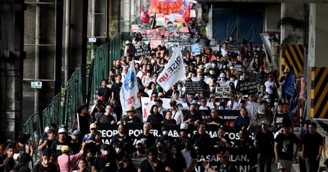 Philippine protesters say 'never again' on anniversary of anti-Marcos ...