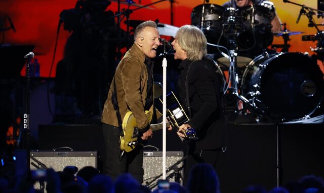 Jon Bon Jovi (R) and singer Bruce Springsteen (L) perform on stage during the 2024 MusiCar