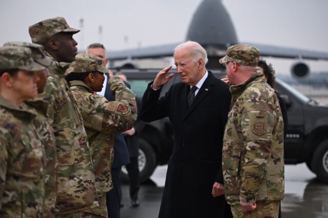 President Joe Biden greets military personnel ahead of the 'dignified transfer' ceremony f