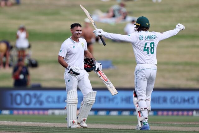 South Africa's David Bedingham (left) is congratulated after reaching his hundred by Ruan