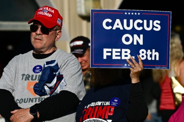 Supporters of former US president and 2024 presidential hopeful Donald Trump watch his spe