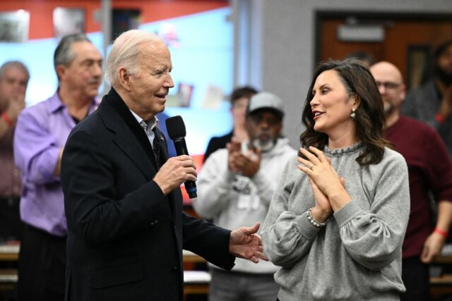 US President Joe Biden speaks alongside Michigan Governor Gretchen Whitmer as he campaigns