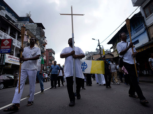Sri Lankan Catholics take out a silent protest march to mark the fourth year commemoration