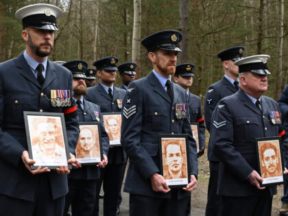 British soldiers pay tribute to Allied prisoners of war who tunneled out of a German POW c