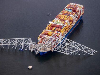 In an aerial view, cargo ship Dali is seen after running into and collapsing the Francis S