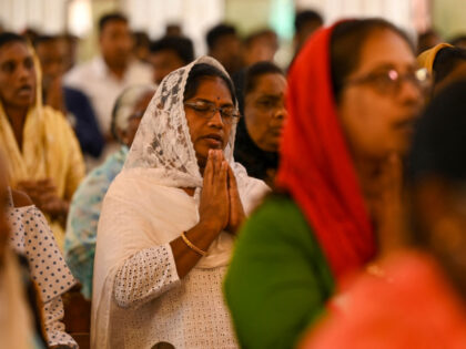 Christian devotees pray during Easter Sunday at a church in Chennai on April 9, 2023. (Pho