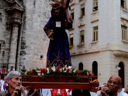 Catholics carry a statue of Jesus Christ during a Holy Week procession on Good Friday in H