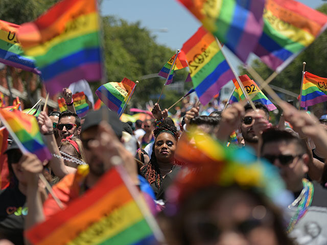 People participate in the annual LA Pride Parade in West Hollywood, California, on June 9,