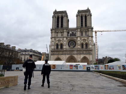French police officers patrol in front of the Notre-Dame-de-Paris Cathedral in Paris, on O