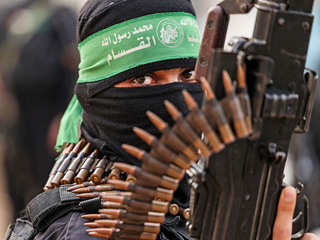 A member of Ezzedine al-Qassam Brigades, military wing of the Palestinian Hamas movement, takes part in a parade in Gaza City on November 14, 2021. (Photo by MAHMUD HAMS / AFP) (Photo by MAHMUD HAMS/AFP via Getty Images)