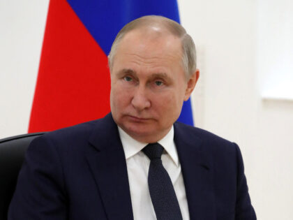 Russia's President Vladimir Putin looks on during talks with Belarus President Alexander L
