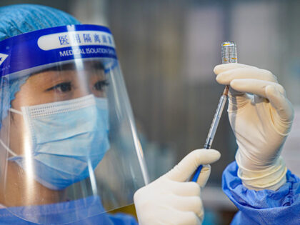 A nurse prepares a Sinovac's COVID-19 vaccine at a hospital on December 26, 2020 in H
