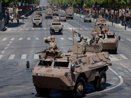 French army soldiers drive Armoured Forward Vehicle (VAB) during the Bastille Day military