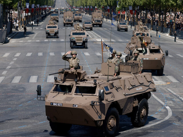 French army soldiers drive Armoured Forward Vehicle (VAB) during the Bastille Day military