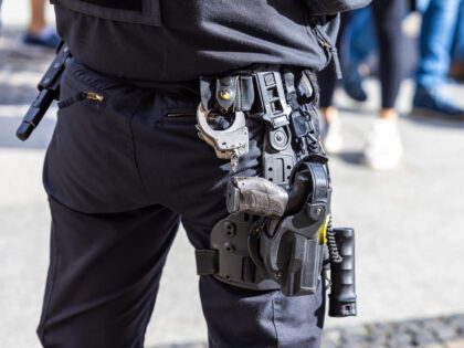 Equipment-belt of a German police officer with a gun