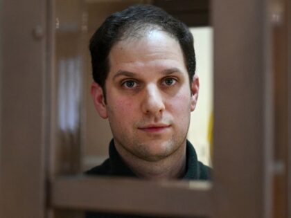 TOPSHOT - US journalist Evan Gershkovich, arrested on espionage charges, looks out from in