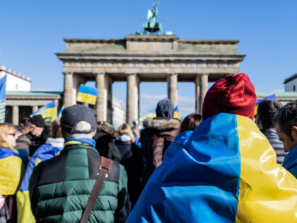 BERLIN, GERMANY - 2024/02/24: Protesters draped in Ukrainians flags take part during the r
