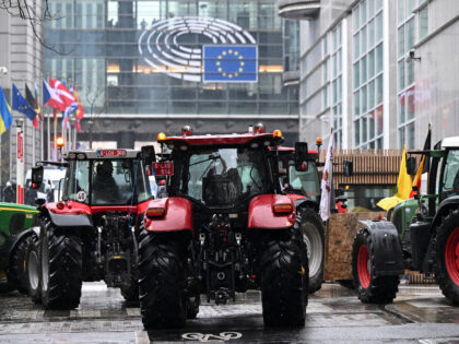 TOPSHOT - Farmers' tractors are stationed in front of the European Parliament during a pro