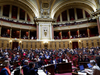 French Senators attend a debate for a vote on a government plan to enshrine the "free