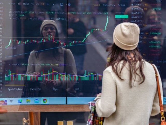 Bitcoin price charts in the window of a cryptocurrency exchange bureau in Istanbul, Turkey