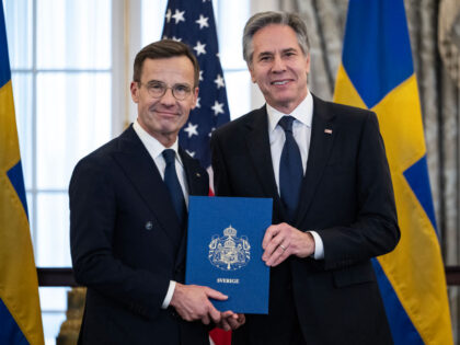 TOPSHOT - US Secretary of State Antony Blinken receives the NATO ratification documents fr