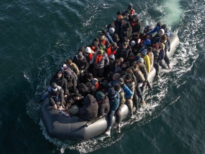 ENGLISH CHANNEL - MARCH 06: An inflatable dinghy carrying around 65 migrants crosses the E
