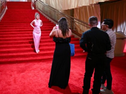 A view of red carpet area as people pose during preparation at the Dolby Theatre ahead of