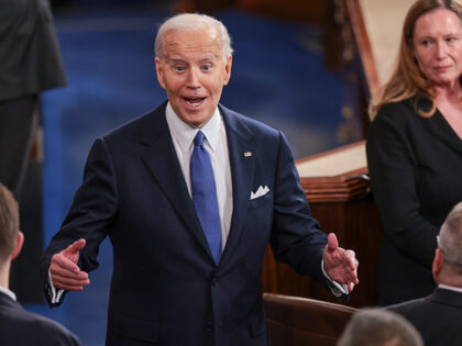 President Joe Biden greets members of Congress after he delivered the State of the Union a