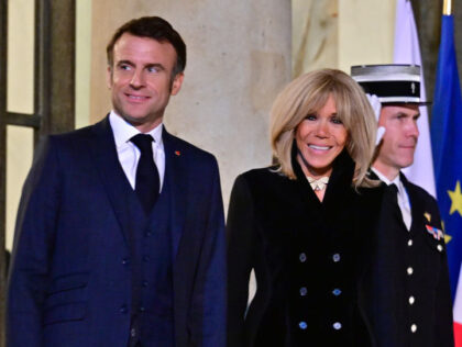 PARIS, FRANCE - MARCH 12: France's President Emmanuel Macron (L) and his wife Brigitt