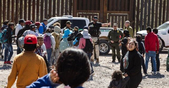 WATCH: Migrants Take Selfies After Breaching Border Wall Into Arizona