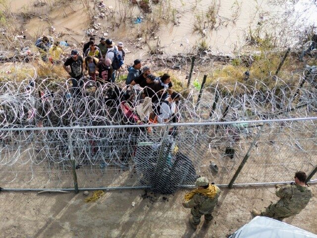 WATCH: Large Migrant Group Pushes Past Texas Military at El Paso Border