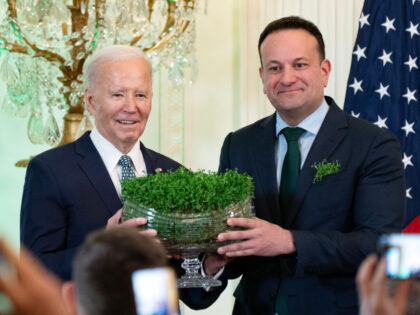 Leo Varadkar, Ireland's prime minister, right, presents US President Joe Biden with a