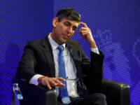 Britain's Prime Minister Rishi Sunak reacts after delivering a speech during a visit to th