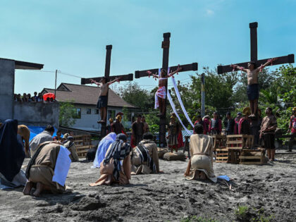 Philippine Christian devotees take part in the re-enactment of the crucifixion of Jesus Ch
