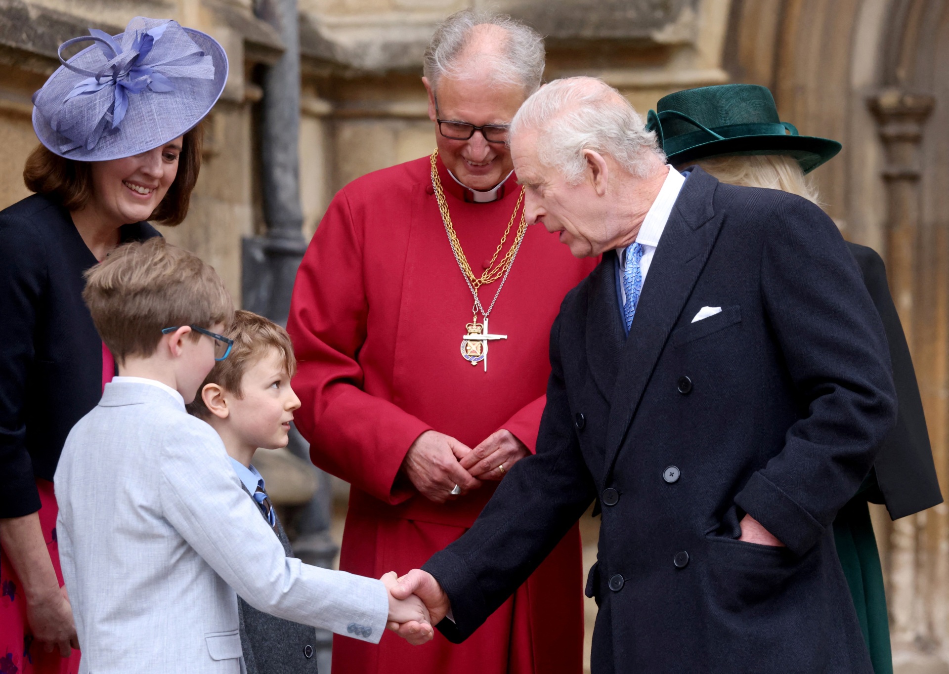 Britain's King Charles III greets well-wishers as he leaves St. George's Chapel, in Windsor Castle, after attending the Easter Mattins Service, on March 31, 2024. (Photo by Hollie Adams / POOL / AFP) (Photo by HOLLIE ADAMS/POOL/AFP via Getty Images)