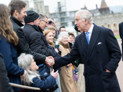 WINDSOR, ENGLAND - MARCH 31: King Charles III and Queen Camilla meet well wishers as they