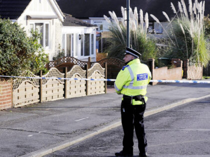 A police community suppoert officer stands near to the home of Edward Syrad, 64, in Barneh