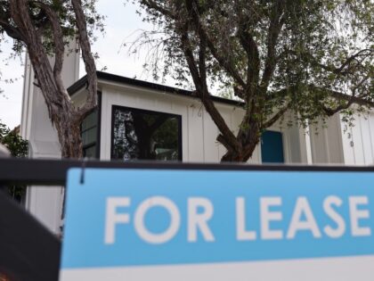 A "For Lease" sign is posted outside a house available for rent on March 15, 202