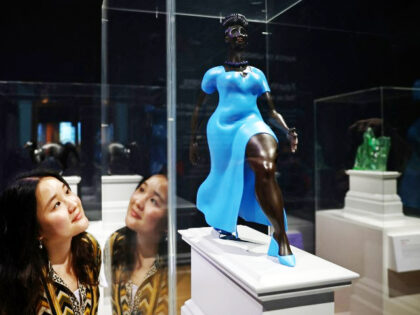 US artist Tschabalala Self's artwork entitled "Lady in Blue" (C) and Romani
