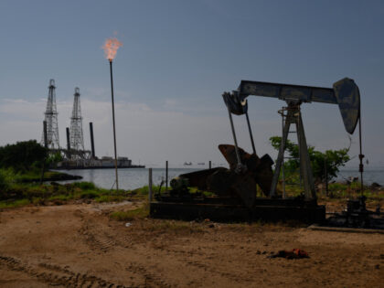 A Petroleos de Venezuela SA (PDVSA) oil pumpjack on Lake Maracaibo in Cabimas, Zulia state