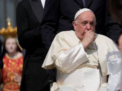 Pope Francis coughs during his weekly general audience in St. Peter's Square at The Vatica