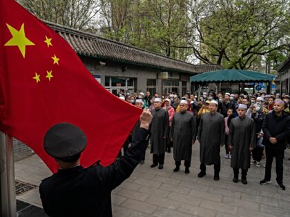 BEIJING, CHINA - APRIL 22: Chinese Muslim worshippers gather as the national flag is raise