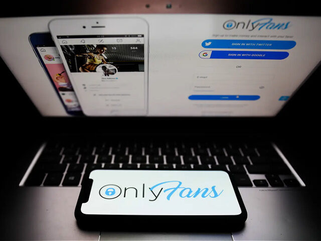 OnlyFans logo displayed on a phone screen and a website displayed on a laptop screen are s