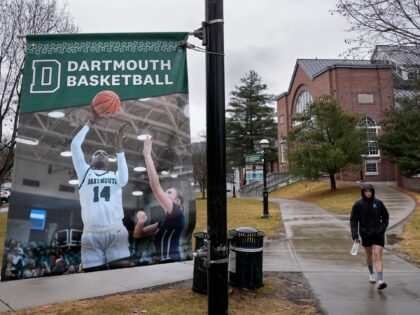 A student walks near the Alumni Gymnasium on the campus of Dartmouth College, Tuesday, Mar