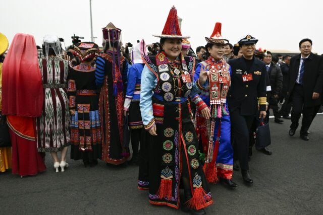 Ethnic minority delegates arrive for the opening ceremony of the Chinese People's Politica